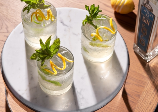 Black Drum Brewing Twelve 33 Distillery cocktail with mint garnish and lemon twist