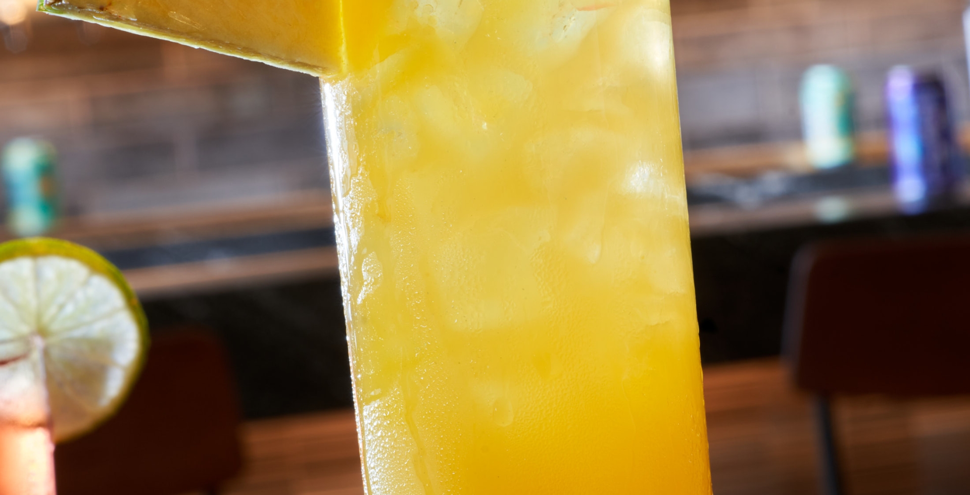 Black Drum Brewing Sandy Shandy cocktail garnished with a pineapple wedge and cherry