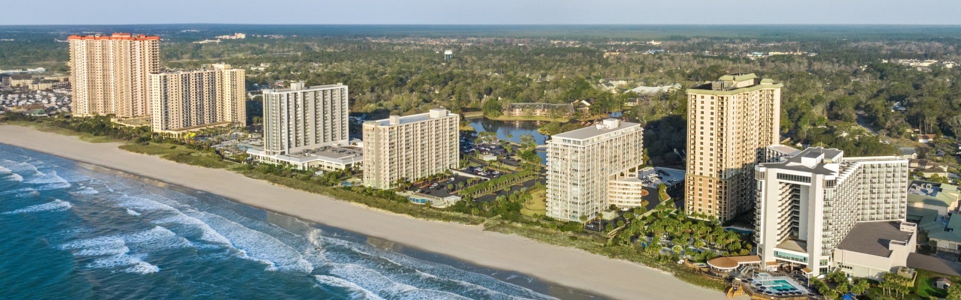 Aerial of Kingston Resorts beachfront hotels and condos