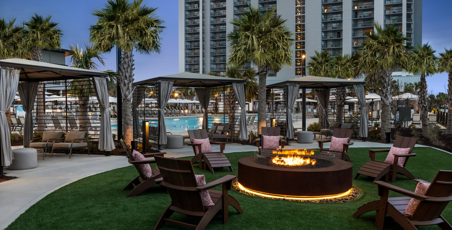 Beach camp cabanas and firepit at Currents Seaside Entertainment