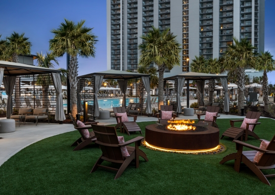 Beach camp cabanas and firepit at Currents Seaside Entertainment