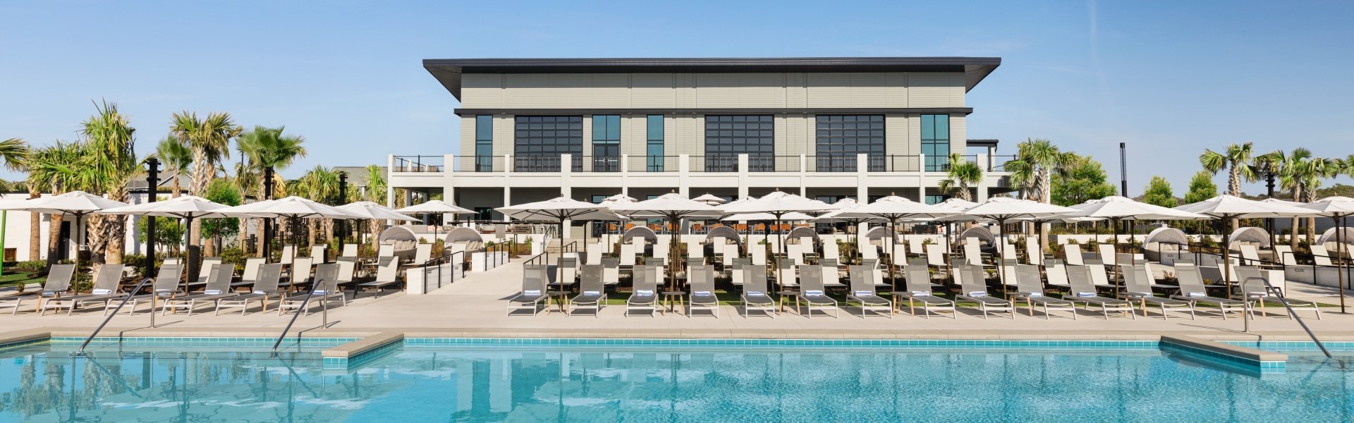 Currents Seaside Entertainment main pool facing the lounge chairs and Black Drum Brewing