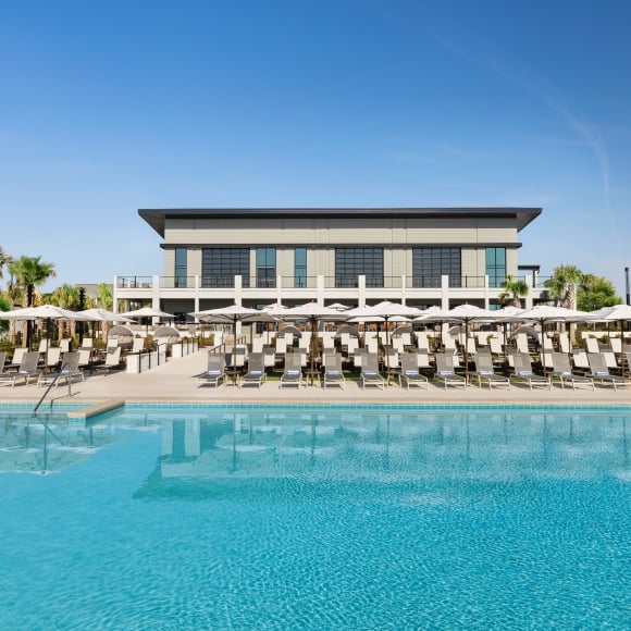 Currents Seaside Entertainment main pool facing the lounge chairs and Black Drum Brewing