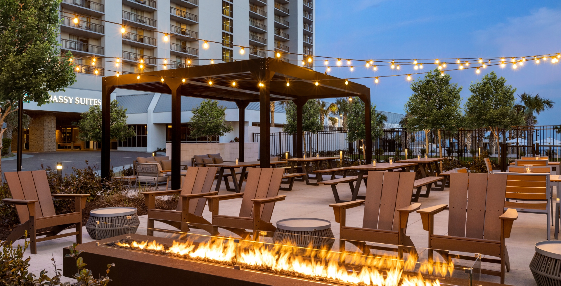 Black Drum Brewing beer garden with seating areas and a long firepit