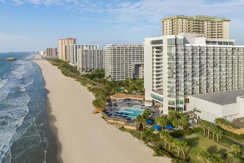 An aerial shot of Kingston Resorts starting at Hilton and looking down towards The Apache Pier