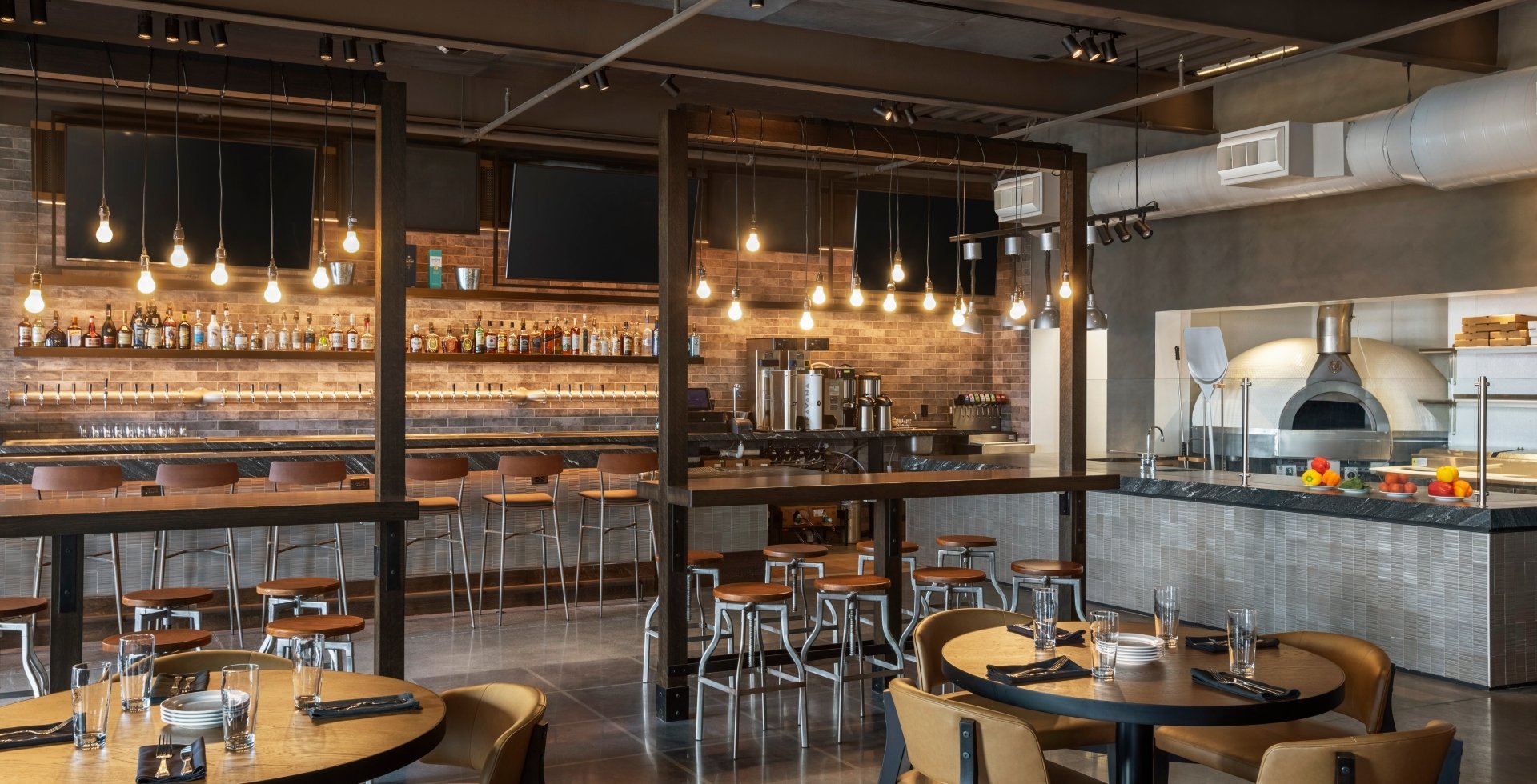 Interior of Black Drum Brewing bar area and pizza station