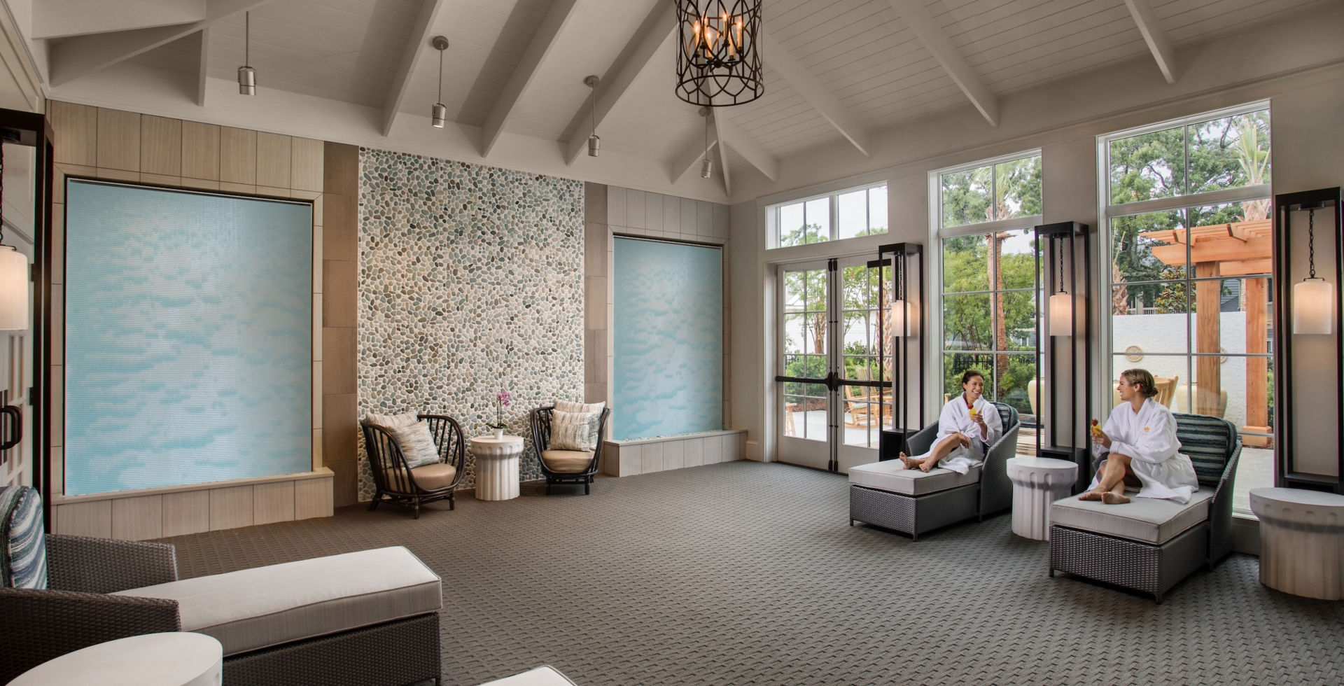 Two ladies enjoying mimosas in Spa33 relaxation room