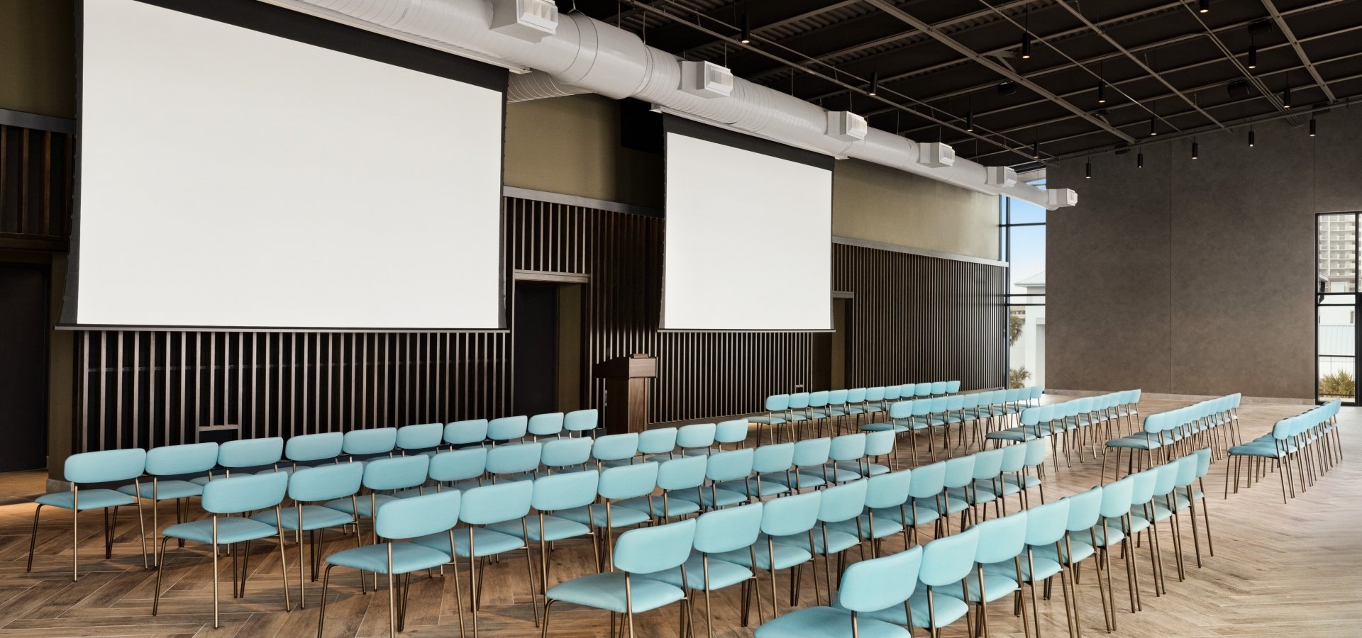 Seaside Vista set up for a meeting with projection screens