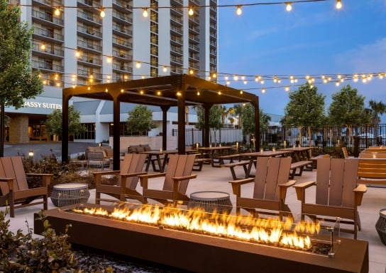 Black Drum Brewing beer garden with a fireplace and Edison lights
