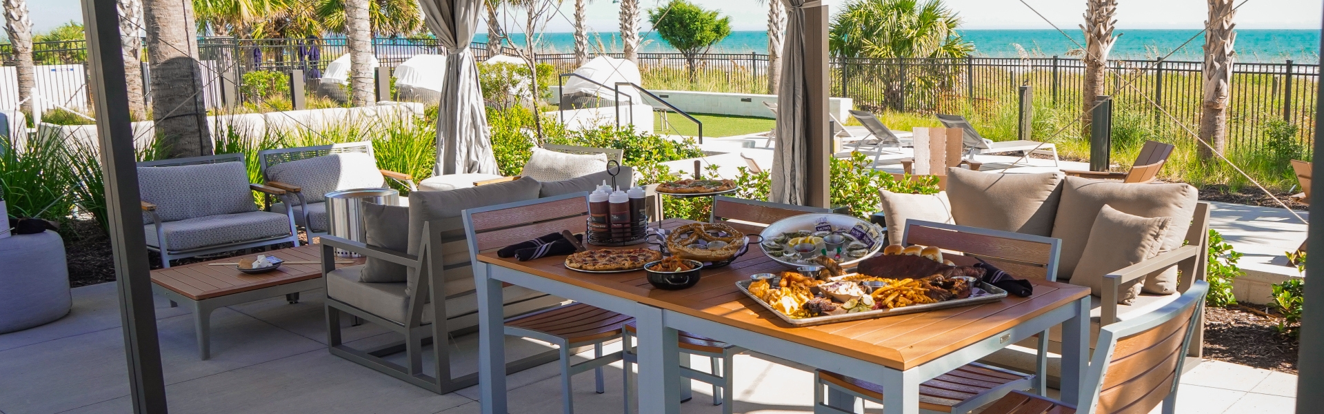 Dinner and Smores inside a Currents Seaside Entertianment cabana