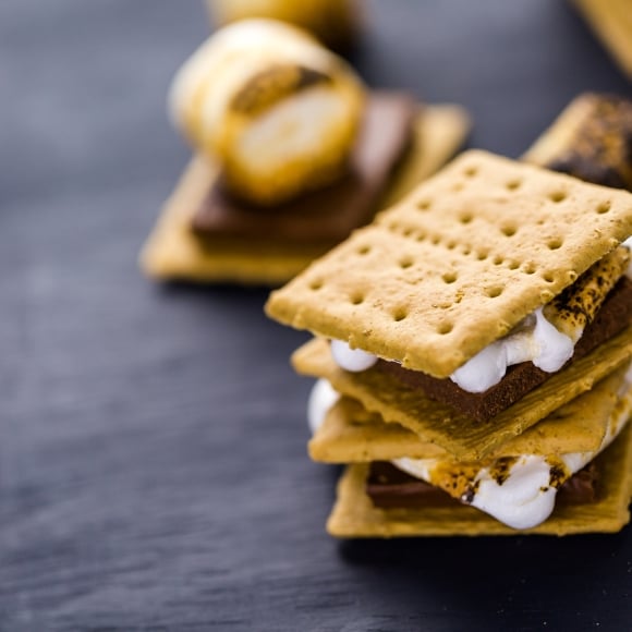 Freshly toasted smores with large white marshmallows.