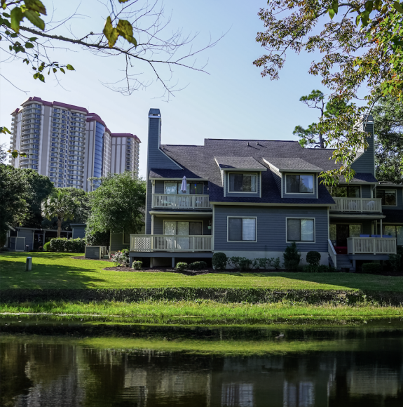 View of the pond, villas, and ocean front hotel