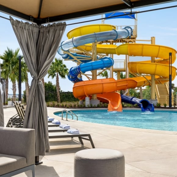 View of Currents Seaside Entertainment waterslides from inside of a cabana
