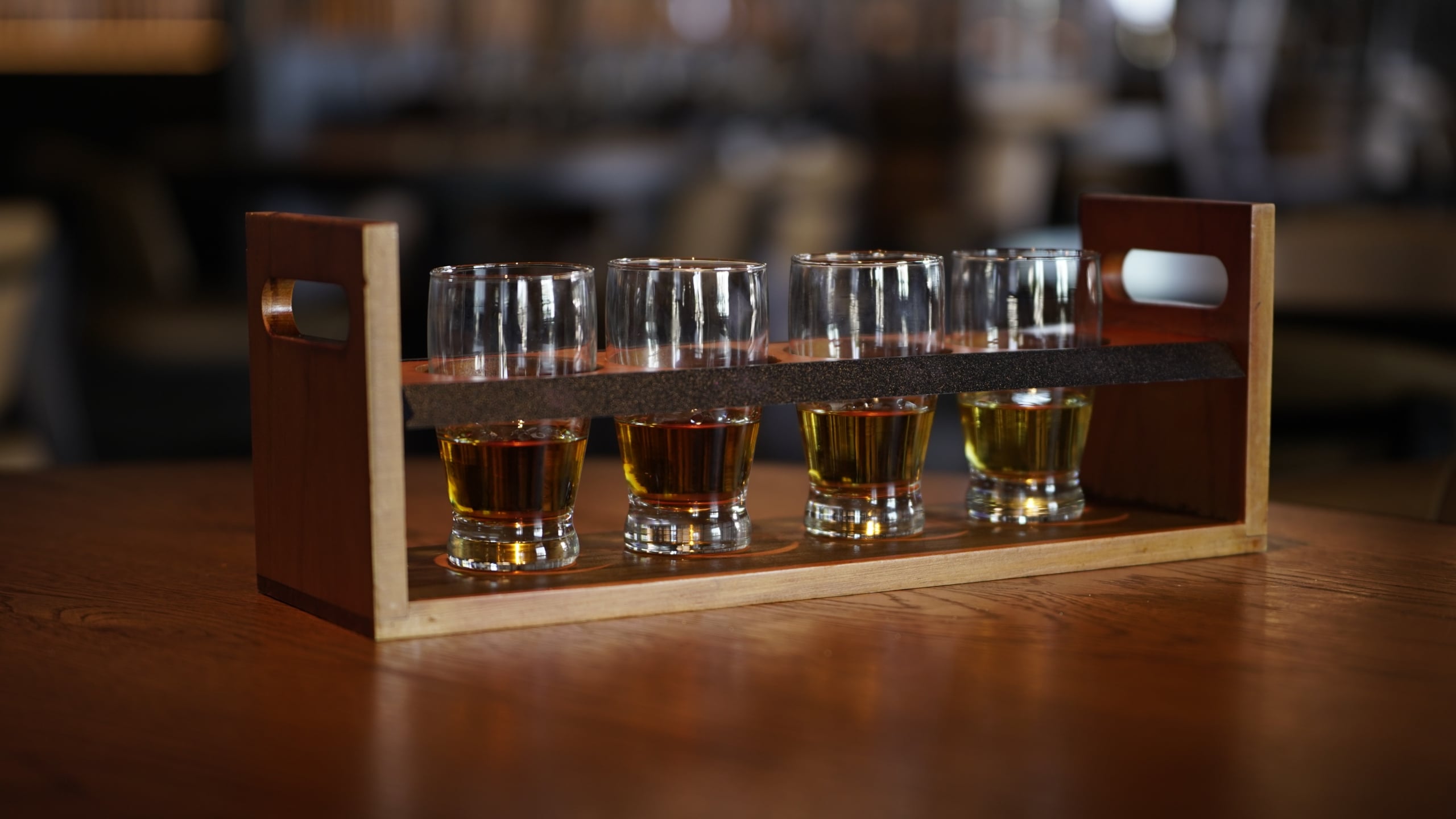 Black Drum Brewing whiskey flight on a restaurant table