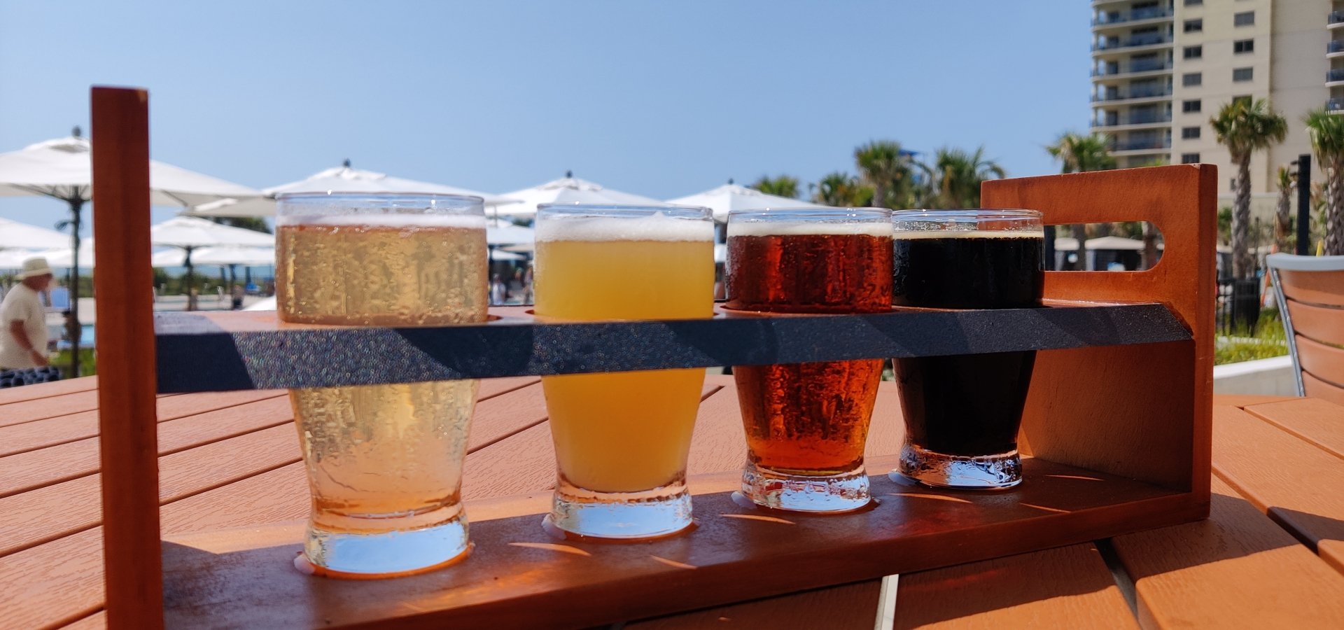 Black Drum Brewing beer flight on the outdoor patio table