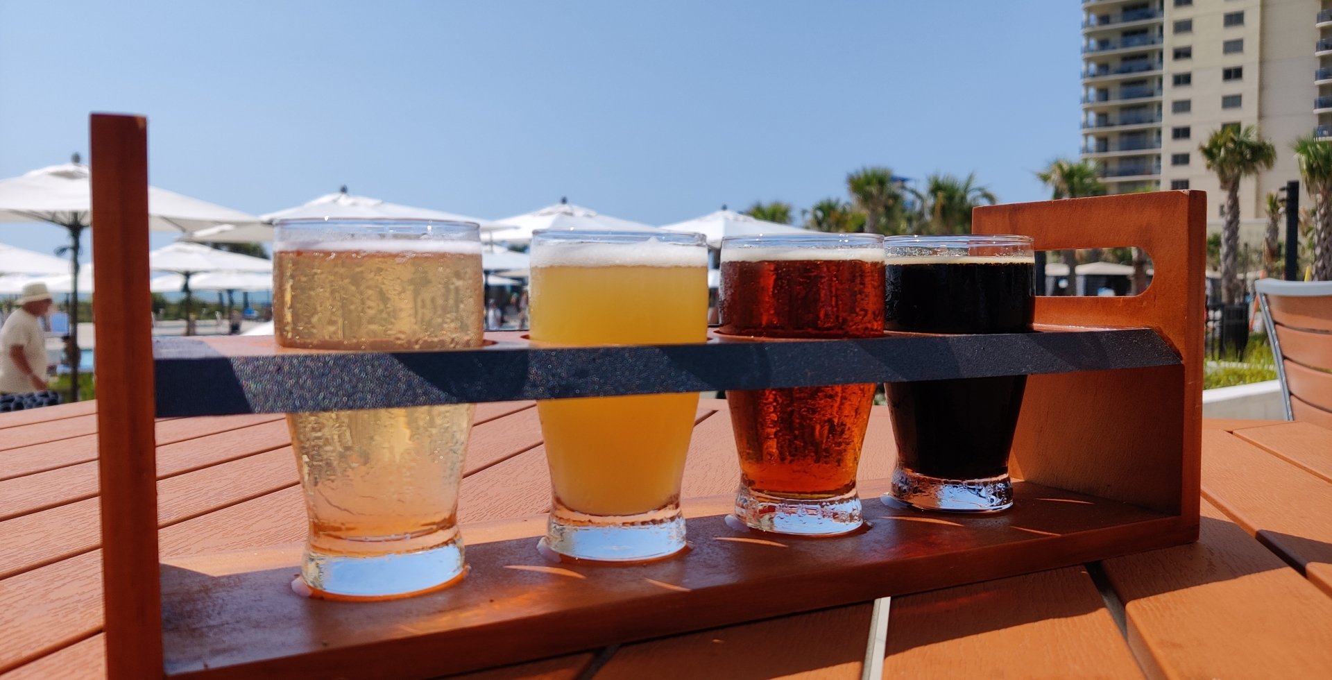 Black Drum Brewing beer flight on the outdoor patio table