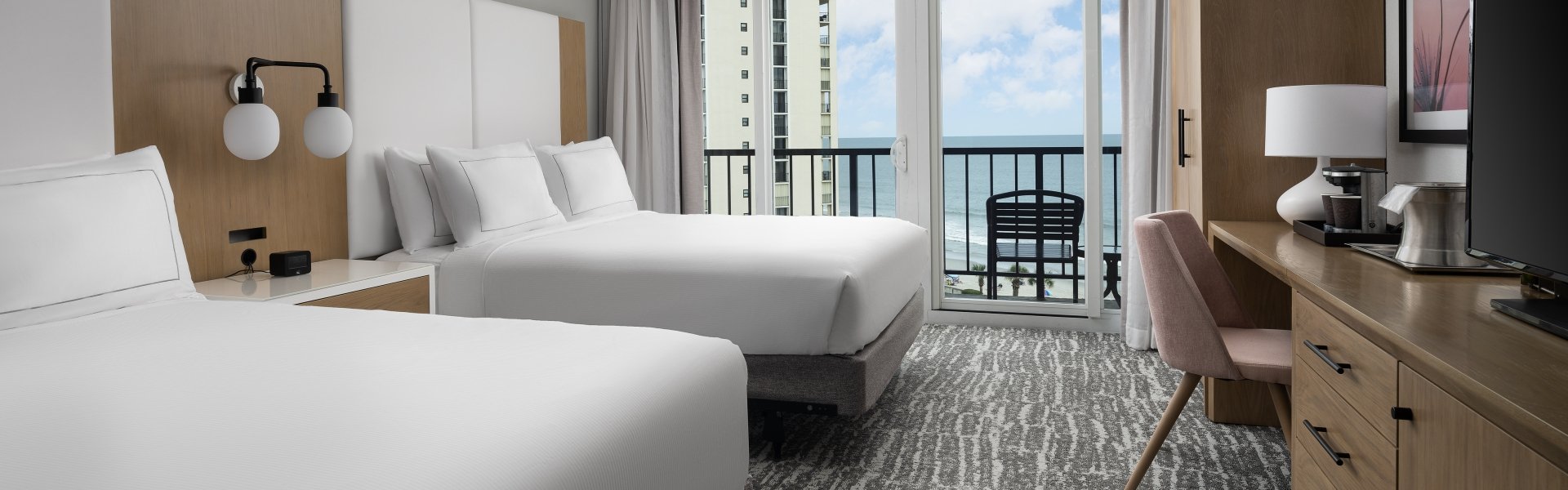 Double bed guest room at Hilton with a balcony