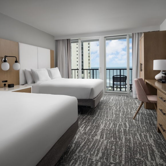 Double bed guest room at Hilton with a balcony