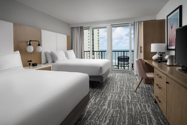 Double bed guest room at Hilton with a balcony