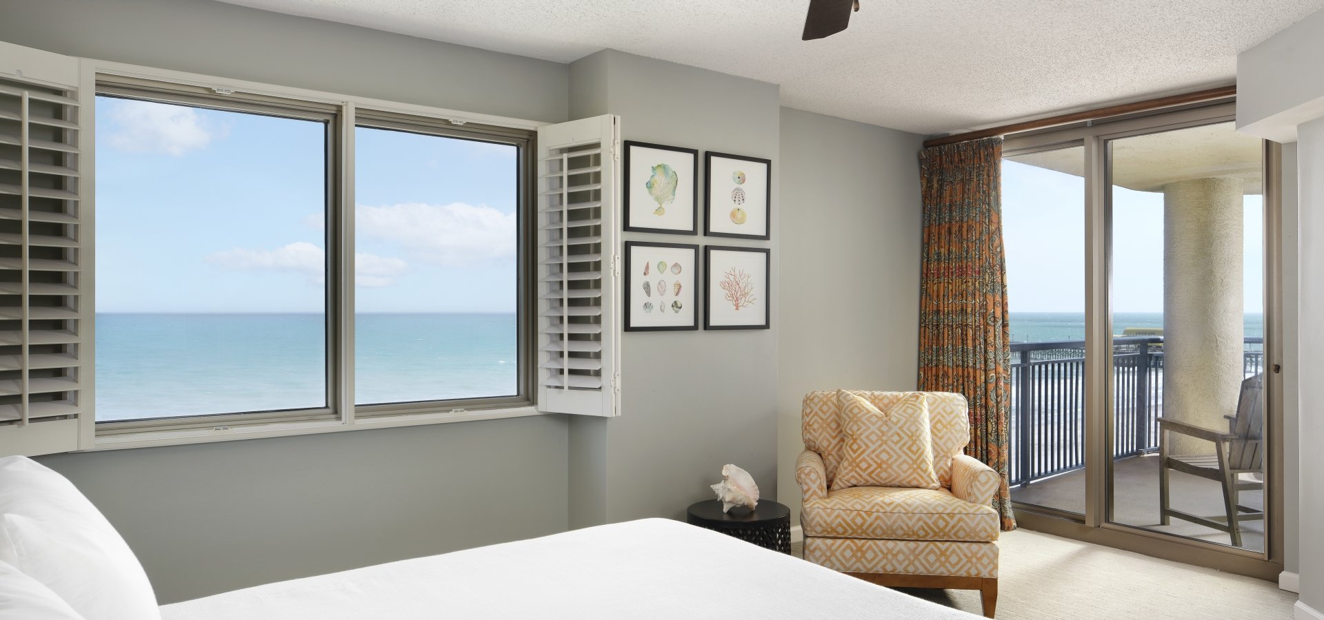 Brighton Master bedroom with balcony access and ocean view