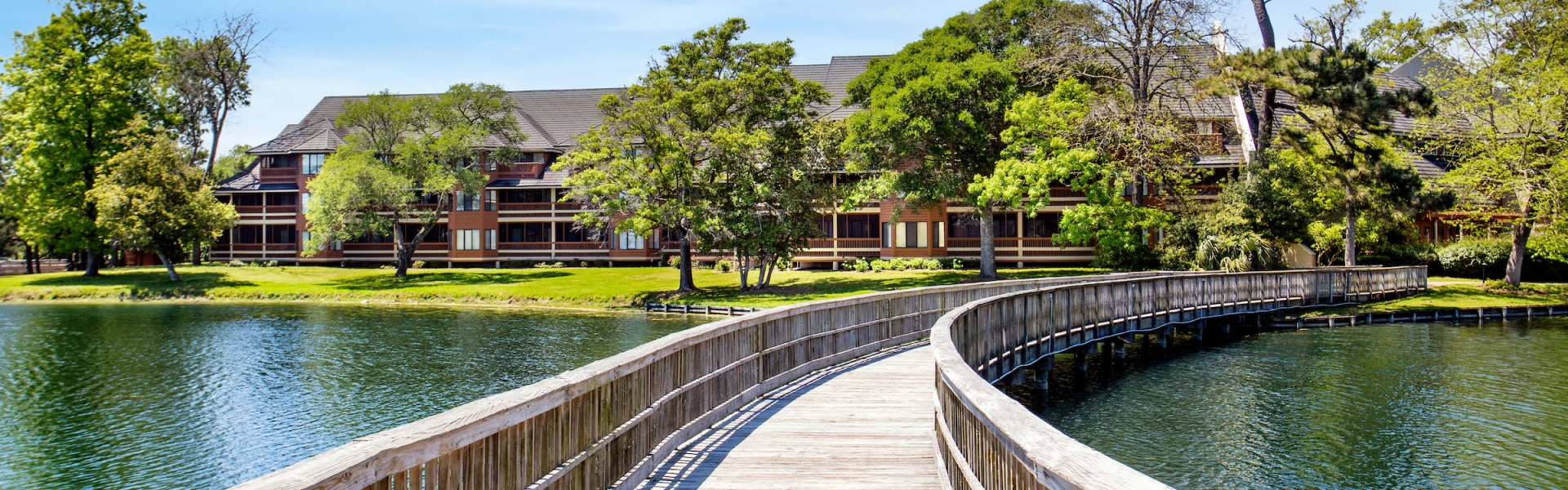 Exterior bridge and pond view of Kingston Condos