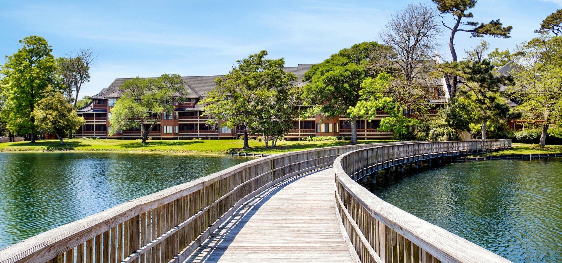 Exterior bridge and pond view of Kingston Condos
