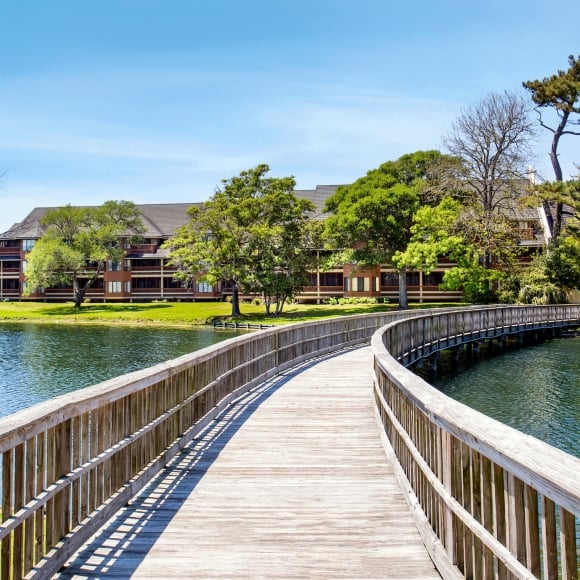 Exterior bridge and pond view of Kingston Condos