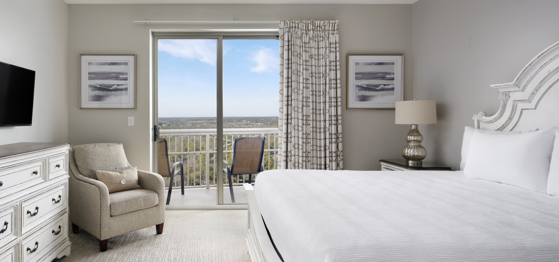 Margate condo master bedroom with balcony access and a resort view