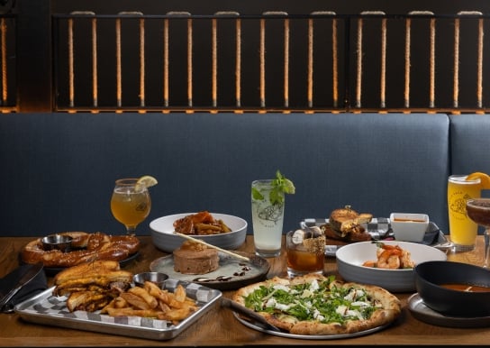 Table spread of eight different menu items featured on a fall menu