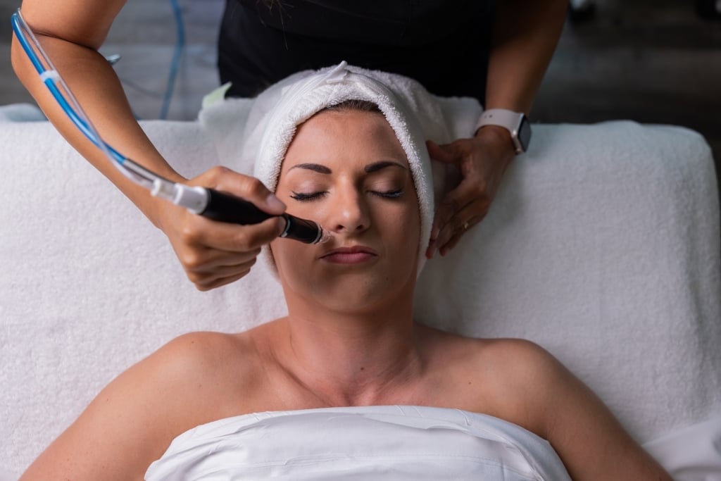 Guest enjoying a facial treatment at Spa33 at Kingston Resorts