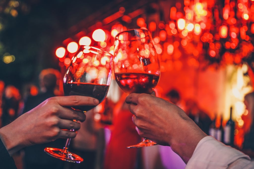 Couple toasting with wine glasses after their wedding